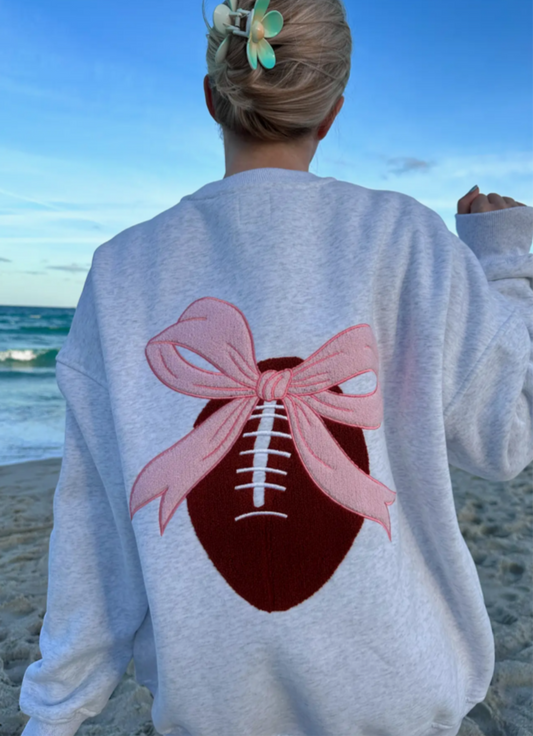 Bow On A Football Sweatshirt