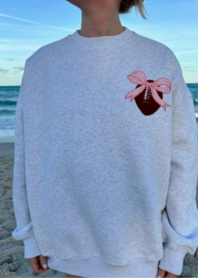 Bow On A Football Sweatshirt